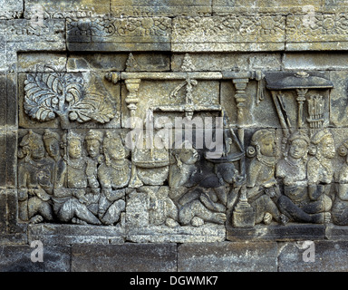 Détail d'un mur de secours le complexe du temple de Borobudur, site inscrit au Patrimoine Mondial de l'UNESCO, Borobudur, Yogyakarta, Java Banque D'Images