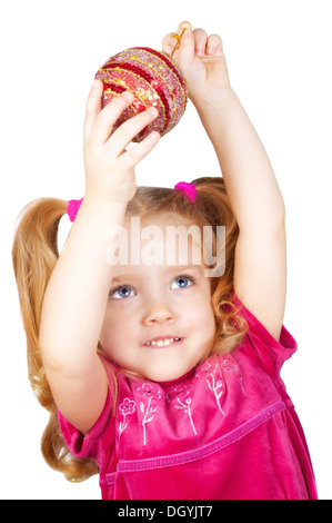 Girl holding a Christmas decoration Banque D'Images