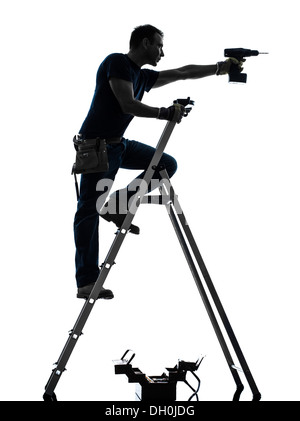 Un travailleur manuel man standing drilling en silhouette sur fond blanc Banque D'Images