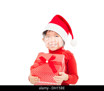 Smiling little girl holding christmas gift Banque D'Images