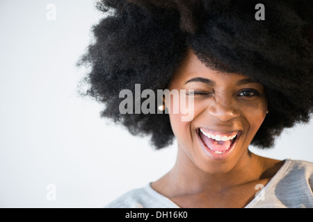 Mixed Race woman winking Banque D'Images