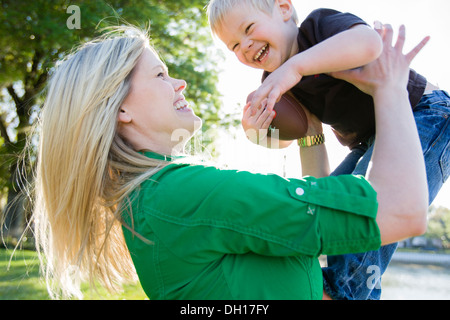 Caucasian woman Playing with son