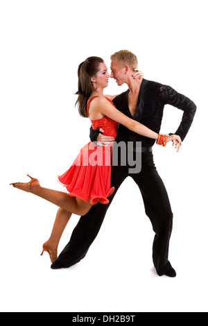 Les jeunes danseurs de bal en costumes officiels posant sur un fond uni dans un studio Banque D'Images