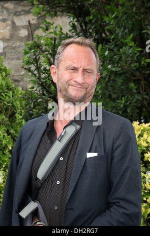 6e Festival du Film Francophone d'Angoulême (sud-ouest de la France) : Benoît Poelvoorde posant pendant un photocall le 2013/08/24 Banque D'Images