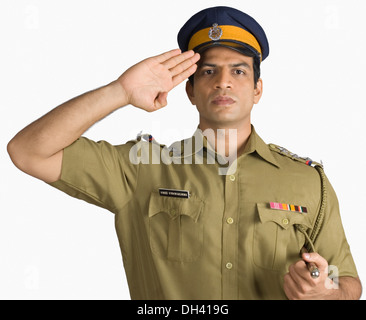 Portrait of a policeman saluting Banque D'Images