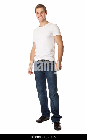 Toute la longueur d'un mignon jeune homme en jeans et t-shirt Banque D'Images