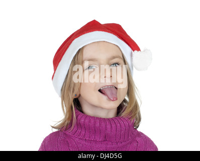 Little girl with santa hat met sa langue Banque D'Images