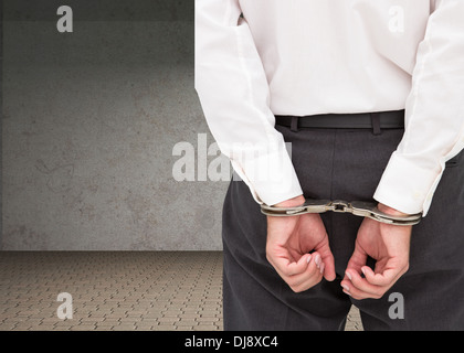 Close up on young businessman wearing handcuffs Banque D'Images