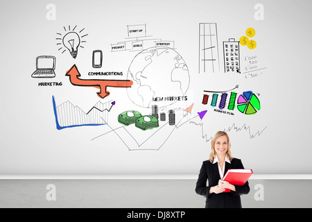 Businesswoman smiling and holding folders Banque D'Images