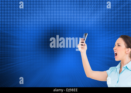 Image composite de angry classy businesswoman yelling at her smartphone Banque D'Images