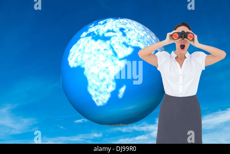 Composite image of businesswoman looking through binoculars Banque D'Images