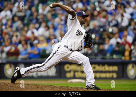 Milwaukee Brewers pitcher LaTroy Hawkins falls as he delivers against the  Minnesota Twins in a baseball game Friday, July 1, 2011 in Minneapolis. (AP  Photo/Andy King Stock Photo - Alamy