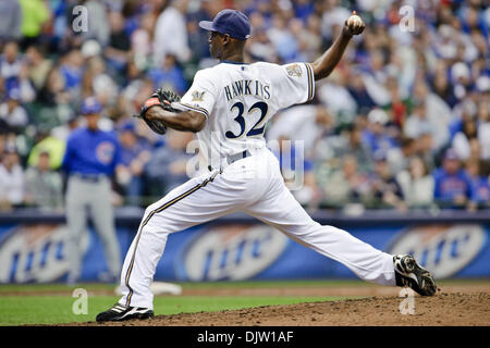 Milwaukee Brewers pitcher LaTroy Hawkins falls as he delivers against the  Minnesota Twins in a baseball game Friday, July 1, 2011 in Minneapolis. (AP  Photo/Andy King Stock Photo - Alamy