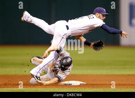 New York Yankees' Brett Gardner, right, slides into home plate past Los  Angeles Angels catcher Ryan Budde to score the go-ahead run on Alex  Rodriguez's sacrifice fly against the Angels' Jeff Mathis