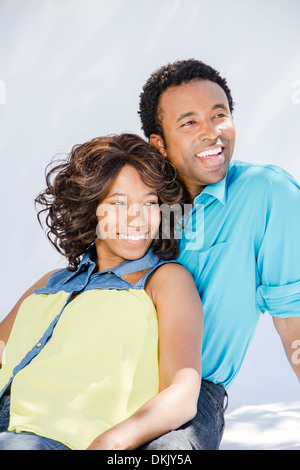 Happy young couple on white background Banque D'Images