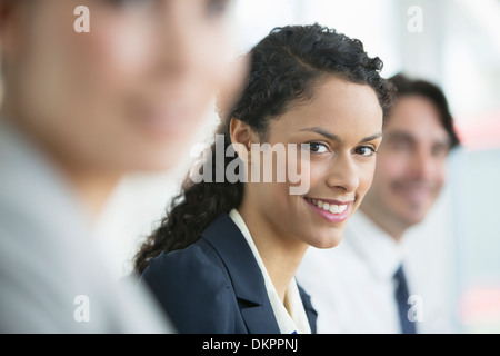 Businesswoman smiling in meeting Banque D'Images