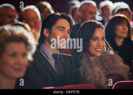 Close up of smiling couple in theater audience Banque D'Images