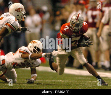 Déc 29, 2004 ; San Antonio, TX, USA ; NCAA Football - Ted Ginn Jr (7) exécute pour le yardage durant la MasterCard Alamo Bowl dans l'Alamo Dome à San Antonio. Banque D'Images