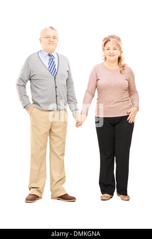 Full Length portrait of a middle aged couple holding hands and posing Banque D'Images