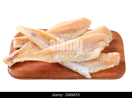 Filets de poisson frais on cutting board Banque D'Images