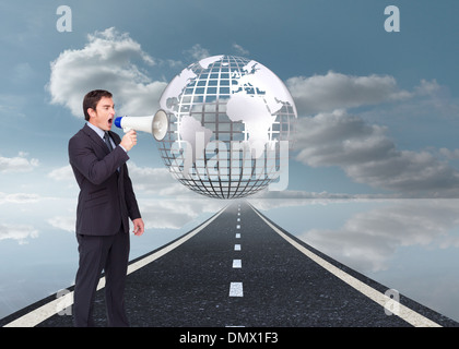 Image composite de standing businessman shouting through a megaphone Banque D'Images