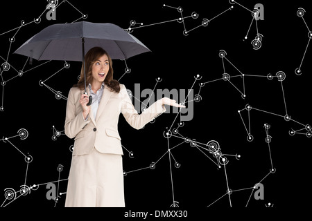 Composite image of businesswoman holding glasses Banque D'Images