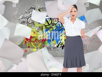 Composite image of classy businesswoman holding newspaper Banque D'Images