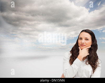 Composite image of businesswoman posing Banque D'Images