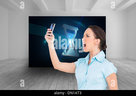 Image composite de angry classy businesswoman yelling at her smartphone Banque D'Images