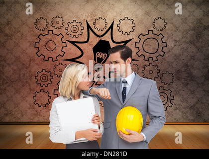 Image composite d'architectes avec plans and hard hat looking at each other Banque D'Images