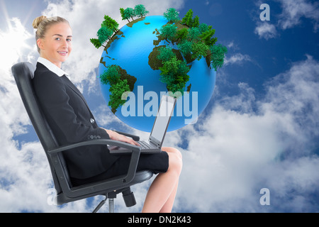 Image composite de businesswoman looking at camera Banque D'Images