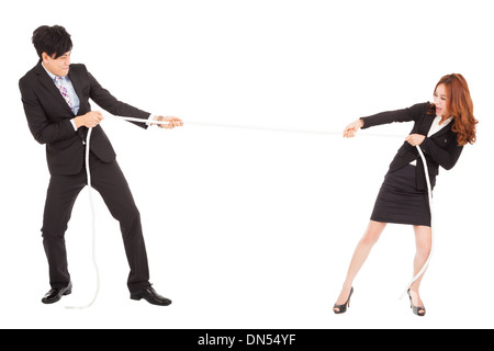 Businessman and woman playing Tug of War Banque D'Images