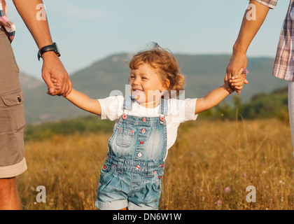 Heureux père et mère avec fille Banque D'Images