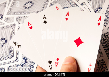 Hand holding a quatre as cartes à jouer Banque D'Images