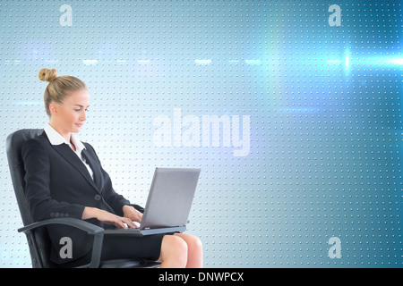 Image composite de businesswoman looking at camera Banque D'Images