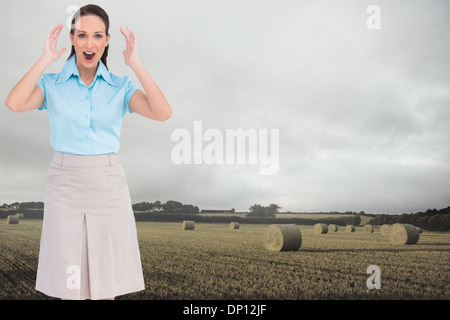 Composite image élégant businesswoman posing Banque D'Images