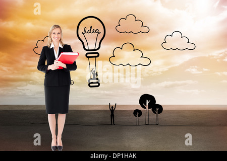 Image composite de businesswoman smiling and holding folders Banque D'Images