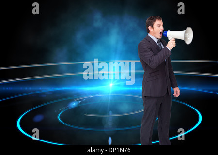 Image composite de standing businessman shouting through a megaphone Banque D'Images