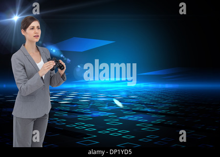 Composite image of businesswoman with binoculars Banque D'Images