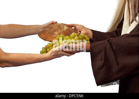 Jésus donne du pain et des raisins sur fond blanc Banque D'Images