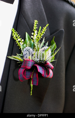 Boutonnière de mariage avec ruban tartan Banque D'Images