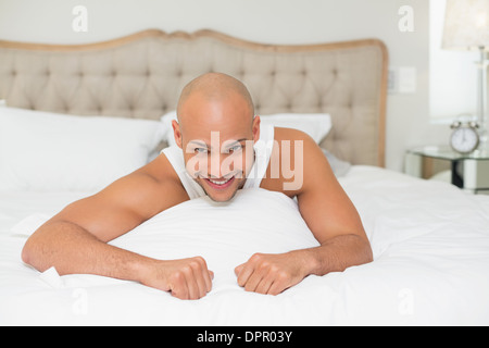 Close up portrait of a man resting in bed Banque D'Images