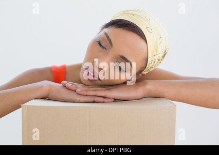 Pretty young woman resting head cases plus Banque D'Images