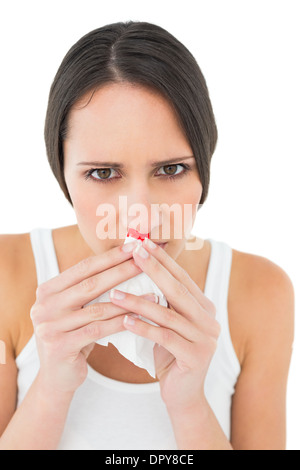 Close-up portrait of a young woman avec saignement du nez Banque D'Images