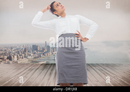 Image composite de peur businesswoman Banque D'Images