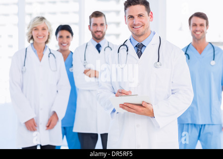 Confident happy group of doctors at medical office Banque D'Images