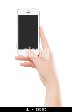 Tenir la main féminine moderne blanc smart phone avec écran blanc et appuyant sur le bouton avec le pouce. Isolé sur fond blanc. Banque D'Images