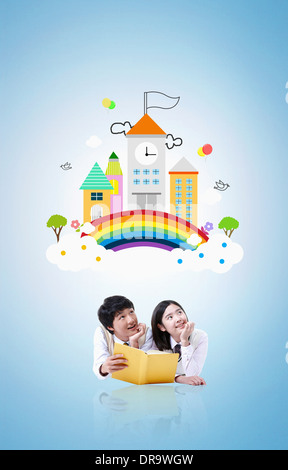Un couple de lire un livre illustré avec l'arrière-plan de l'école Banque D'Images