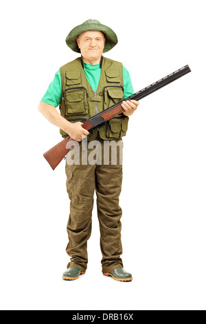 Portrait d'homme tenant un fusil chasseur Banque D'Images
