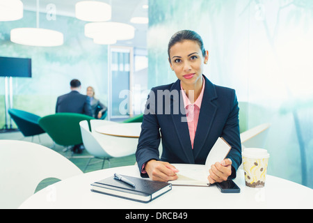 Businesswoman smiling in cafe Banque D'Images
